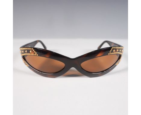 A striking pair of vintage Gianni Versace sunglasses, Model 440/X, in a rich tortoiseshell acetate frame with a dramatic cat-