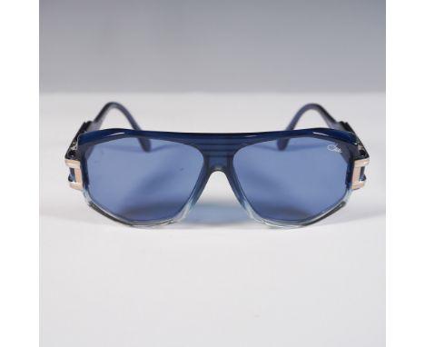 Bold and distinctive, this pair of Cazal Legends 163/3 sunglasses features a translucent blue acetate frame with gold-tone an