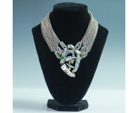 A striking and artistic statement piece, this 15-inch choker necklace by designer Connie Bates is titled "Multi Tango." The c
