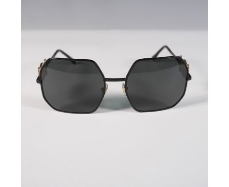 A striking pair of Versace Model 2248 sunglasses featuring an oversized geometric black metal frame with dark lenses. These l