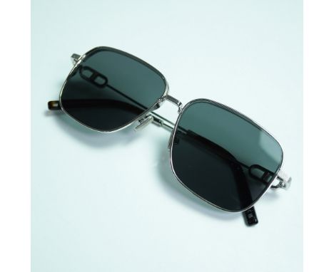 Christian Dior CD Link N1U sunglasses with silver-tone square frames and dark lenses. Features textured temples and signature