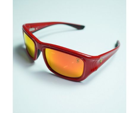 Ray-Ban Ferrari Limited Edition RB 4405-M wrap-style sunglasses featuring a bold red frame with Ferrari branding. Designed fo