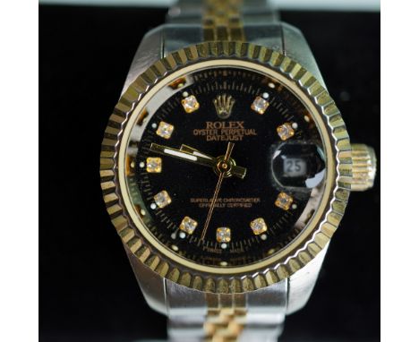 Classic Rolex Oyster Perpetual Datejust wristwatch featuring a two-tone design in stainless steel and gold accents. The black