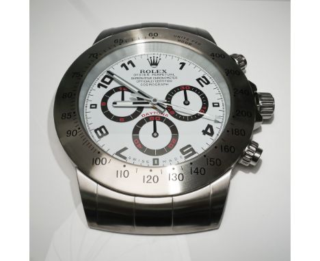 A striking Rolex Oyster Perpetual Cosmograph Daytona wall clock, inspired by the iconic Rolex Daytona wristwatch. This oversi