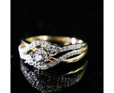 A striking sterling silver and gold-plated diamond ring showcasing a captivating wave-like design. The centerpiece features a
