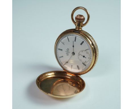 A distinguished Elgin National Watch Co. 14K gold hunter case pocket watch, showcasing the timeless craftsmanship of American
