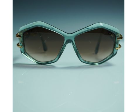A striking pair of Cazal MOD 8507 sunglasses, made in Germany, known for their bold geometric frames and luxurious gold detai