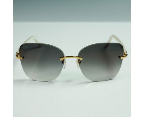 A luxurious pair of Cartier rimless sunglasses featuring gradient gray lenses, a sleek gold-tone bridge, and signature gold h