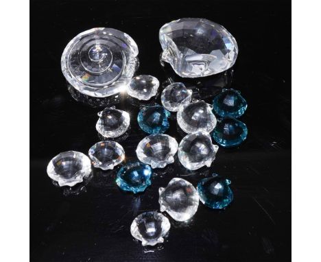A captivating Swarovski crystal collection featuring a variety of nautical-themed pieces, including two faceted crystal shell