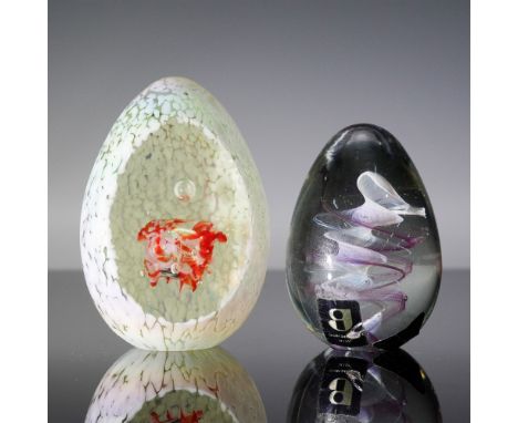 Enchanting set of two hand-blown art glass paperweights, each showcasing distinctive craftsmanship and color. One piece, bear