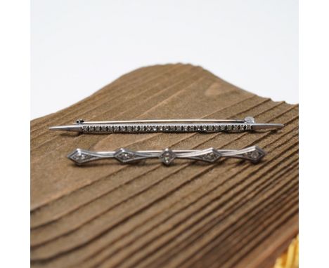 Pair of vintage sterling silver bar pins featuring delicate geometric designs. One pin showcases a refined milgrain pattern w