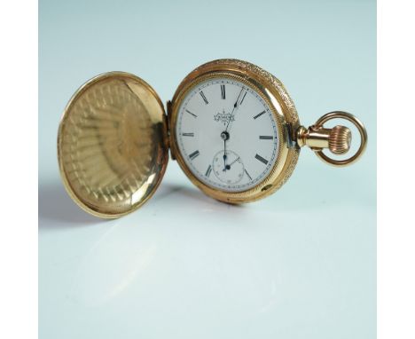 A finely crafted Elgin National Watch Co. hunter case pocket watch, featuring an exquisite engraved gold case with intricate 