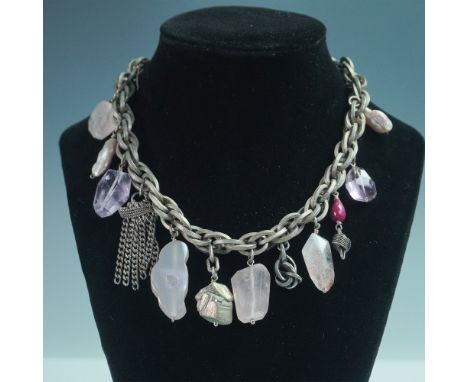 A striking 15-inch charm-style necklace featuring an eclectic mix of natural gemstones, including faceted amethyst, rose quar
