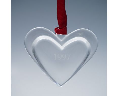 Orrefors clear crystal heart-shaped ornament dated 1997, etched with the Orrefors name on the edge. Finished with a red hangi