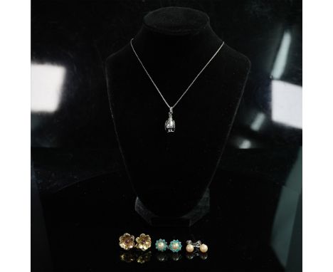 A charming sterling silver jewelry set featuring a whimsical penguin pendant on a delicate box chain necklace, marked 925. Th