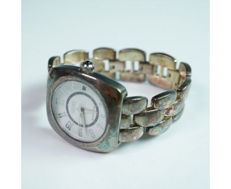 A sophisticated Ecclissi wristwatch crafted with a sterling silver case and a bracelet marked 925, offering a blend of durabi