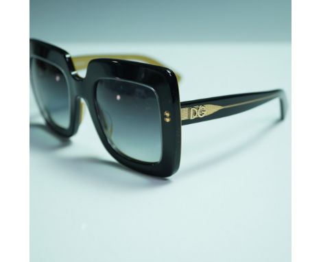 Dolce &amp; Gabbana oversized square sunglasses, model DG4263, color code 2955/8G, featuring a bold two-tone black and mustar
