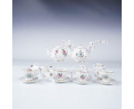 Charming Royal Albert miniature tea set ornaments, consisting of two boxed sets with a total of six pieces. Each set features