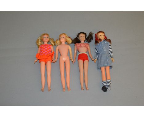 Four Mattel Barbie dolls: three Skooter, one blonde, one brunette, one titian; Twist n Turn Skipper. (4)