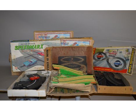 A quantity of boxed tinplate roadway sets including one by Marx. 