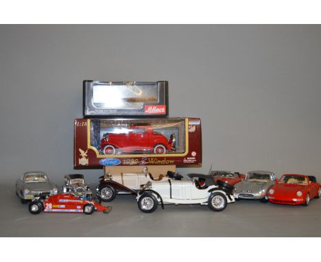 A boxed Road Legends 1932 Ford car in 1:18 scale, VG in VG box together with nine unboxed larger scale diecast model cars and