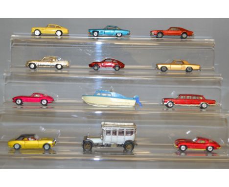 Twelve unboxed Corgi Toys diecast model cars, including 218 Aston Martin DB4 in yellow, a Buick Riviera in metallic gold and 