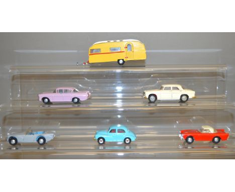 Five unboxed Tri-ang Spot On diecast model cars including a Sunbeam Alpine in red, Morris 1000 in pale blue and a Caravan, ge
