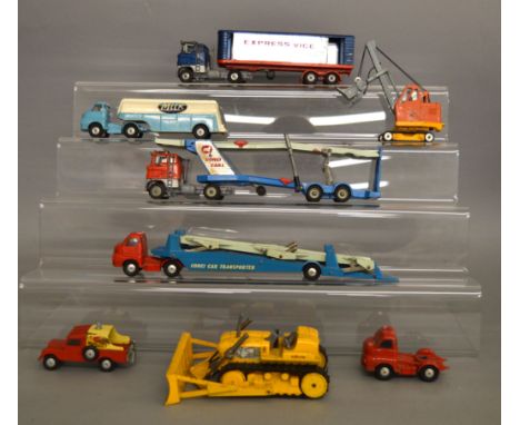 Eight unboxed Corgi Toys diecast model vehicles including Bedford and Ford Car Transporters, Ford 'Express Service' Artic, a 