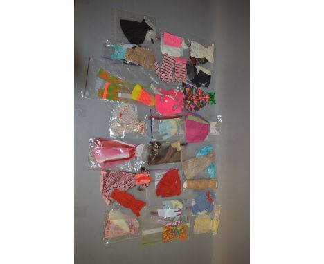 Very good quantity of Mattel Barbie clothing, includes: Barbie in Hawaii; Airline Outfit; etc.