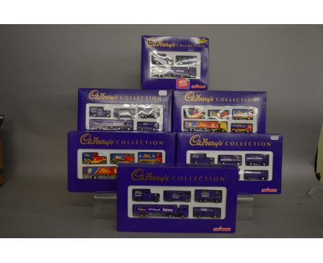 Six boxed Majorette Cadbury's diecast model vehicle sets, 3 x Buttons, 2 x Cream Eggs and one Dairy Milk. Models appear VG in