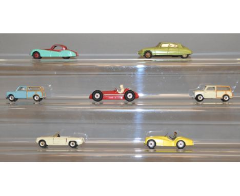 Seven unboxed Dinky Toys diecast model cars, including a two tone 157 Jaguar and a 530 Citroen DS19, made in France, in lime 