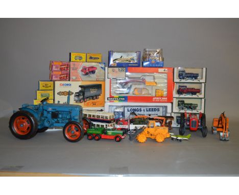 A mixed lot of diecast models by Britains, NZG, Corgi, etc. Some boxed. 