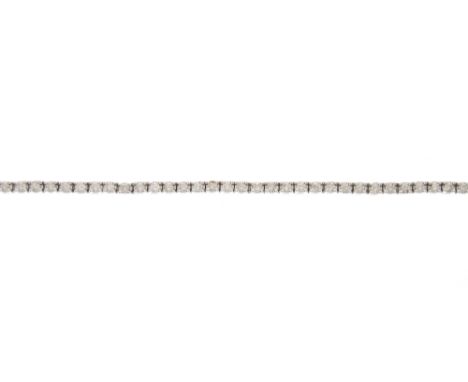 An 18ct gold brilliant-cut diamond line bracelet, with partially concealed push-piece clasp, total diamond weight 2.48ct, sta