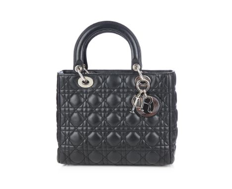 Christian Dior, a black Lady Dior MM handbag, designed with maker's signature cannage quilted black leather exterior, with ri