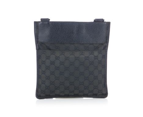 Gucci, a black messenger bag, designed with maker's black GG monogram canvas exterior and grained black leather trim, featuri