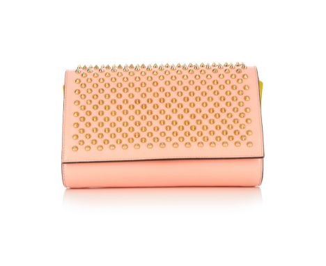 Christian Louboutin, a Paloma clutch, designed with a pink leather exterior with patent leather side panels and gold stud emb