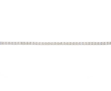 An 18ct gold brilliant-cut diamond line bracelet, with partially concealed push-piece clasp, estimated total diamond weight 5