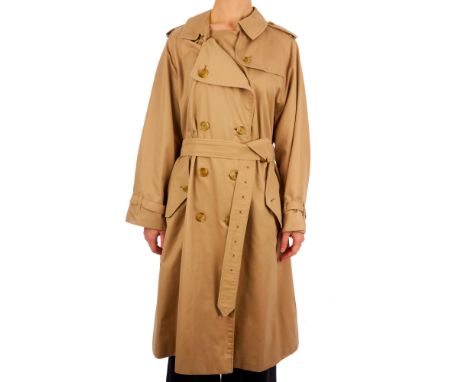 Burberry, a women's classic trench coat, designed with a notched lapel collar, buttoned epaulettes, deep back yoke, double br