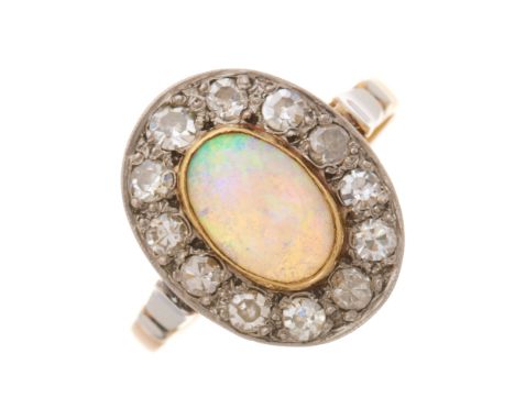 A mid 20th century opal cabochon and single-cut diamond cluster ring, opal measures approximately 9 by 6.4 by 3mm, estimated 