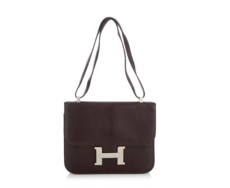 Hermes, a 1999 Constance 24 handbag, crafted from brown Chevre de Coromandel leather, featuring large pores and a central spi