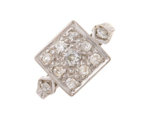 An early 20th century old-cut diamond cluster ring, with similarly-cut diamond accent grooved shoulders, estimated total diam