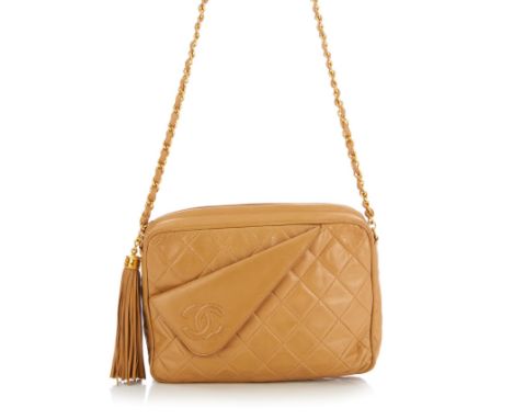 Chanel, a vintage lambskin leather CC Camera Tassel handbag, featuring a beige diamond quilted leather exterior and gold-tone