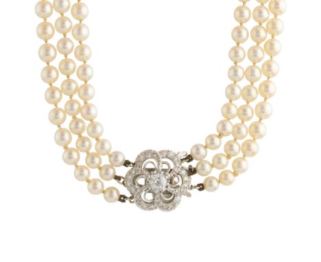 A mid 20th century cultured pearl three-row necklace, with circular-cut diamond openwork clasp, estimated total diamond weigh