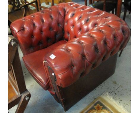 Chesterfield style leather button back armchair.