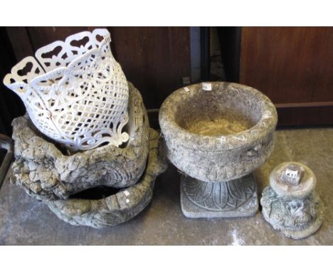 Collection of garden ornaments to include: cast iron foliate pierced planter and composite planters. 