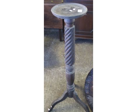 Stained tripod jardiniere stand with spiral column.