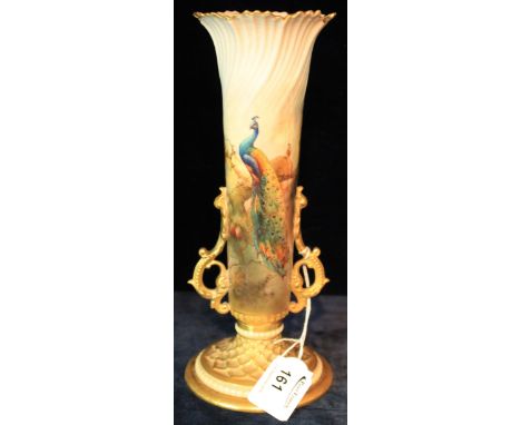 Royal Worcester porcelain two handled vase, printed and painted, depicting peacocks within gilt borders, printed puce marks t