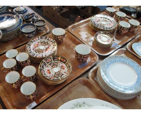 Two trays of Royal Crown Derby 'Imari' design tea and coffee ware items comprising: coffee cups and saucers; teacups and sauc