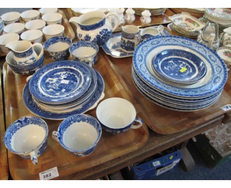 Two trays of assorted blue and white china to include: Burleigh ware 'Willow' teacups and saucers; Adderley ware plates; milk