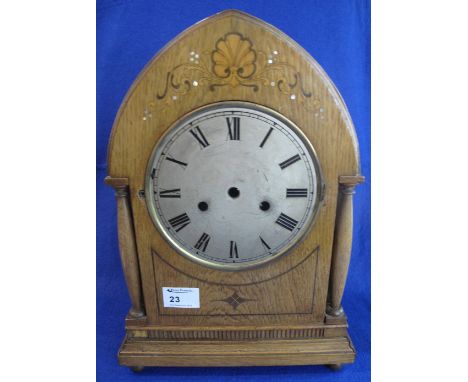 Late 19th Century inlaid oak, lancet shaped, two train bracket clock with silvered Roman face.